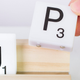 Illustration for article titled You Can Rearrange the Letters and Spell Out Any Message On This Scrabble Tile Rack Lamp